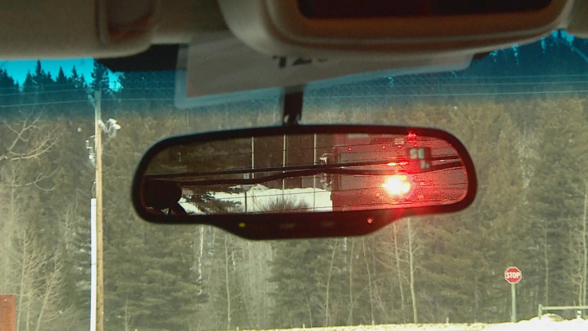 See that red light in the rear-view mirror? Redwood Meadows Fire is hoping you do. And get out of the way. (Monty Kruger/CBC)
